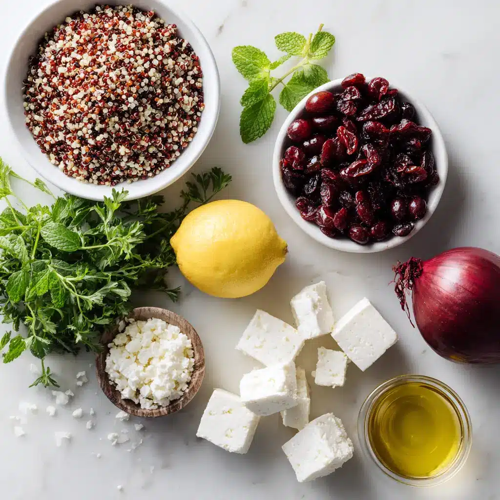 Ingredients for cranberry quinoa salad arranged on a white kitchen counter