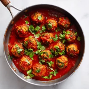 Moroccan sardine balls in tomato sauce in a pan