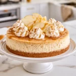 The Best Apple Cider Cheesecake for a Cozy Fall Dessert 2 Creamy apple cider cheesecake topped with whipped cream and apple slices